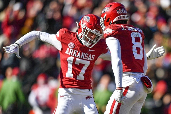 Arkansas defensive backs Hudson Clark (17) and Jayden Johnson (8) celebrate a defensive stop, Saturday, Nov. 12, 2022, during the fourth quarter of the Razorbacks’ 13-10 loss to LSU at Donald W. Reynolds Razorback Stadium in Fayetteville. Arkansas defensive backs Hudson Clark (17) and Jayden Johnson (8) celebrate a defensive stop, Saturday, Nov. 12, 2022, during the fourth quarter of the Razorbacks’ 13-10 loss to LSU at Donald W. Reynolds Razorback Stadium in Fayetteville.