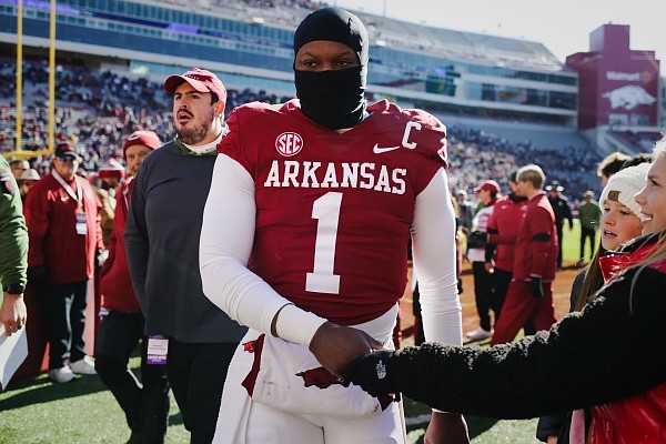 Arkansas quarterback KJ Jefferson greets fans as he walks to the locker room, Saturday, November 12, 2022 before the start of the first quarter of a football game at Donald W. Reynolds Razorback Stadium in Fayetteville.
