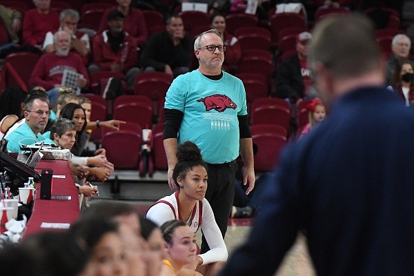 Mike Neighbors watches action on the court during Arkansas’ game against Kent State on Thursday, Nov. 17, 2022, at Bud Walton Arena in Fayetteville.