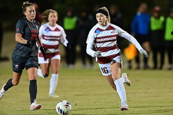 Arkansas' Anna Podojil (16) chases the ball during an NCAA Tournament game against Ohio State on Friday, Nov. 18, 2022, in Fayetteville.