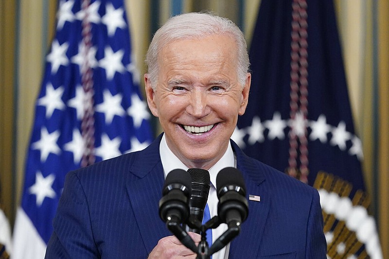 FILE - President Joe Biden smiles as he speaks in the State Dining Room of the White House in Washington, Wednesday, Nov. 9, 2022. (AP/Susan Walsh, File)