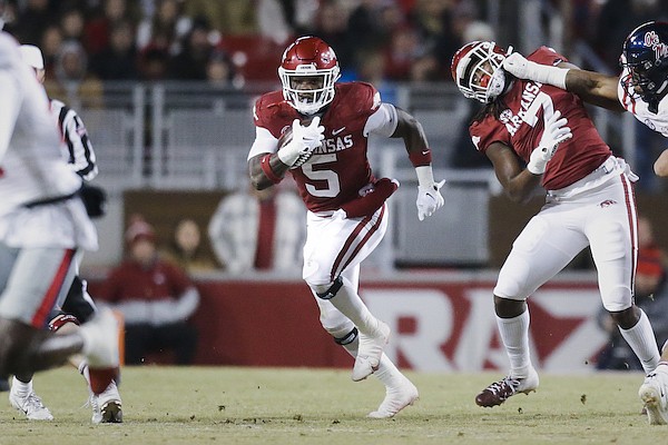 Arkansas running back Raheim Sanders (5) carries the ball during a game against Ole Miss on Saturday, Nov. 19, 2022, in Fayetteville.