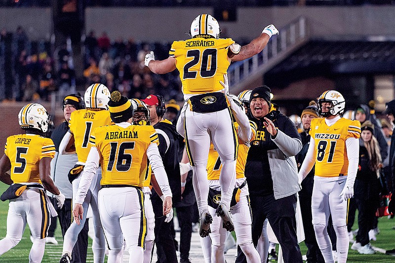 Missouri running back Cody Schrader is lifted by teammates after he scored a touchdown during the second quarter of Saturday night’s game against New Mexico State at Faurot Field in Columbia. (Associated Press)