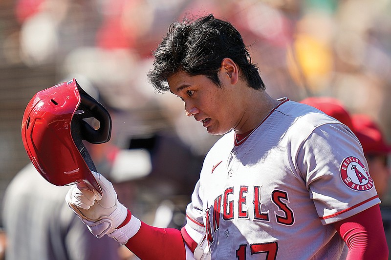 In this Oct. 5 file photo, Shohei Ohtani walks to the Angels' dugout during a game against the Athletics in Oakland, Calif. (Associated Press)