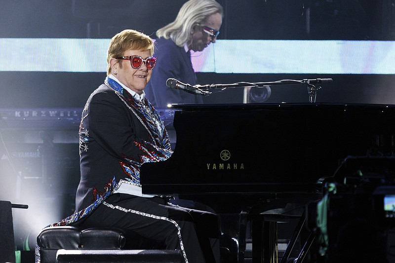 Sir Elton John performs live at the Elton John's final North American show of his "Farewell Yellow Brick Road" tour on Sunday, Nov. 20, 2022, at the Dodger Stadium in Los Angeles. (Photo by Willy Sanjuan/Invision/AP)