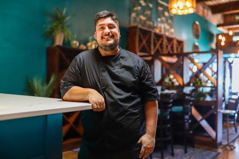 Staff photo by Olivia Ross  / Chef Jonathan Valadez of Cyra's in Dalton, Georgia, poses in the restaurant on Wednesday, Sept. 21, 2022.