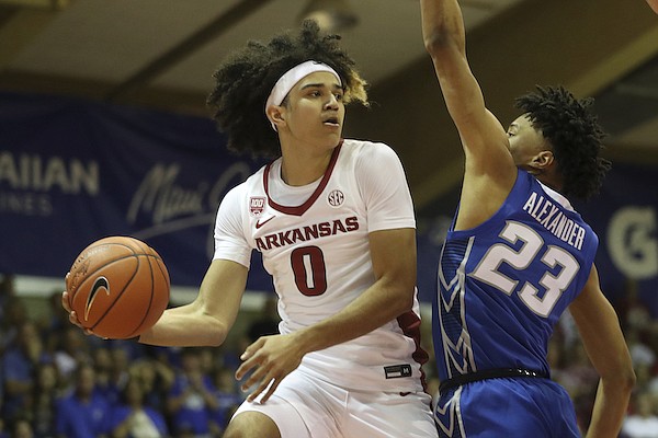 Arkansas guard Anthony Black (0) attempts a pass around Creighton guard Trey Alexander (23) during the first half of an NCAA college basketball game, Tuesday, Nov. 22, 2022, in Lahaina, Hawaii. (AP Photo/Marco Garcia)