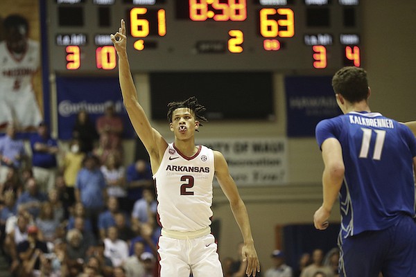 Arkansas forward Trevon Brazile (2) reacts after making a three pointer against Creighton during the second half of an NCAA college basketball game, Tuesday, Nov. 22, 2022, in Lahaina, Hawaii. (AP Photo/Marco Garcia)
