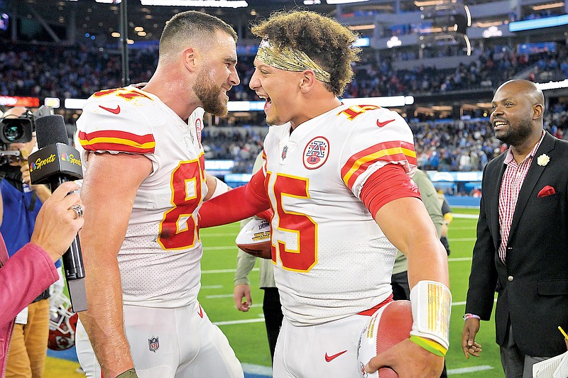 Chiefs tight end Travis Kelce and quarterback Patrick Mahomes celebrate after Sunday night’s 30-27 win against the Chargers in Inglewood, Calif. (Associated Press)