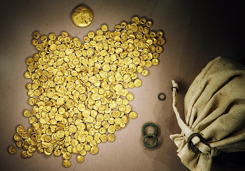 FILE -- Coins of the Celtic Treasure are on display at the local Celtic and Roman Museum in Manching, Germany, May 31, 2006. A senior official said Wednesday that organized crime groups were likely behind the theft of a huge horde of ancient gold coins stolen from a museum in southern Germany this week. (Frank Maechler/dpa via AP, file)