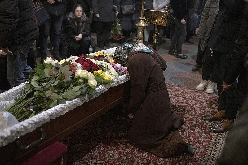 Relatives, friends and comrades mourn Wednesday during the funeral for Ukrainian serviceman Sergii Myronovat at St. Michael’s Golden-Domed Monastery in Kyiv, Ukraine. Myronovat was killed fighting Russian troops in Donetsk region of eastern Ukraine.
(AP/Andrew Kravchenko)