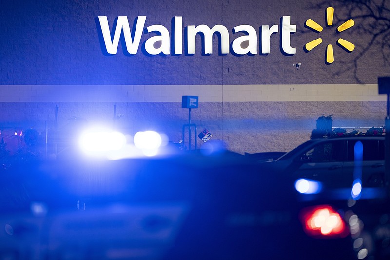 Law enforcement are at the scene of a mass shooting at a Walmart, Wednesday, Nov. 23, 2022, in Chesapeake, Va. (AP Photo/Alex Brandon)