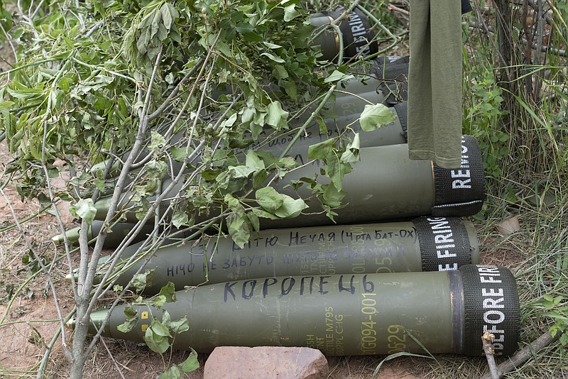 FILE - U.S.-supplied M777 howitzer shells lie on the ground to fire at Russian positions in Ukraine's eastern Donbas region June 18, 2022. The intense firefight over Ukraine has the Pentagon rethinking its weapons stockpiles. If another major war broke out today, would the U.S. have enough ammunition to fight? It’s a question Pentagon planners are grappling with not only as the look to supply Ukraine for a war that could stretch for years, but also as they look to a potential conflict with China. (AP Photo/Efrem Lukatsky, File)