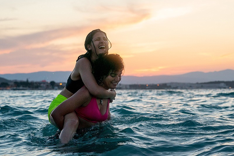 Sisters Nathalie and Manal Issa play, respectively, Syrian sisters Yursa and Sara Mandini, competitive swimmers who dragged a dinghy filled with refugees across the Aegean Sea to safety in the Netflix film “The Swimmers.”