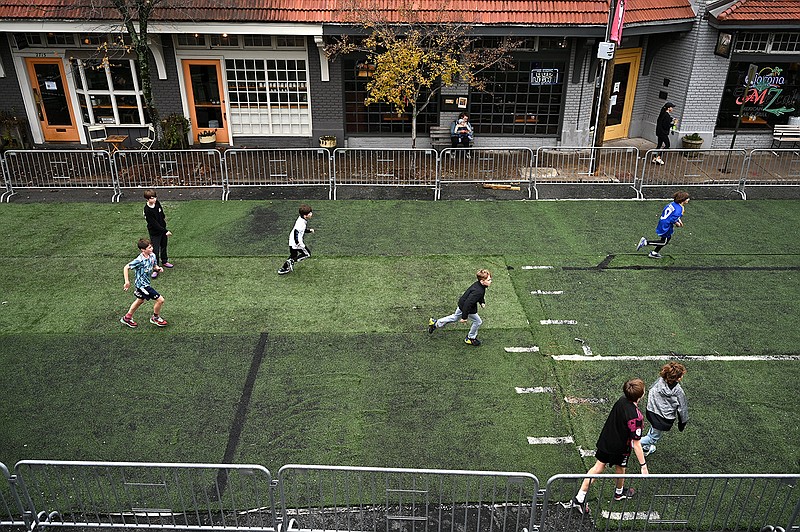 Children play on a makeshift soccer field outside Hill Station on Friday to celebrate the U.S. vs England World Cup soccer match. More photos at arkansasonline.com/1126worldcup/.
(Arkansas Democrat-Gazette/Stephen Swofford)