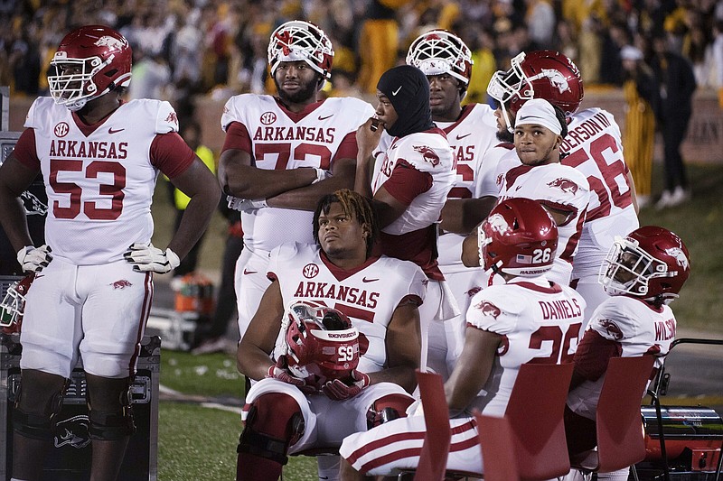 Arkansas players watch the final minute of the team’s 29-27 loss to Missouri on Friday in Columbia, Mo. The Razorbacks finished the regular season at 6-6.
(AP/L.G. Patterson)