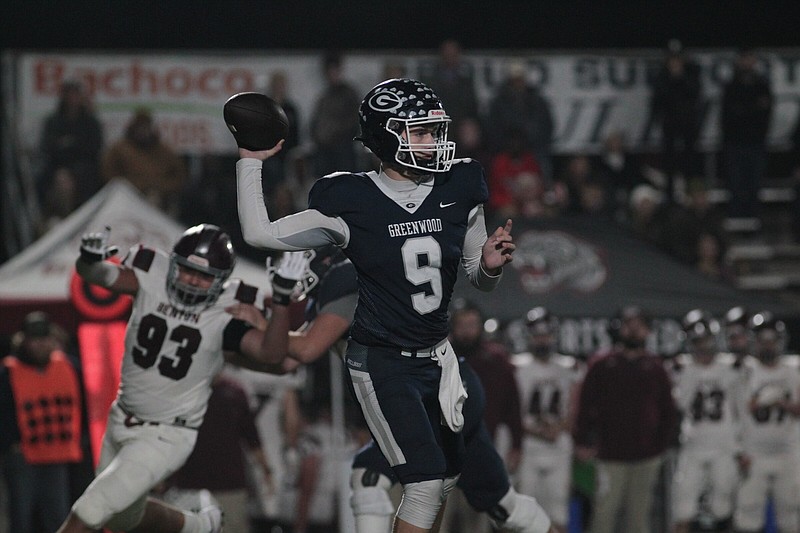 Greenwood quarterback Hunter Houston throws a pass Friday during the Bulldogs’ 31-24 victory over the Benton Panthers in the Class 6A semifinals in Greenwood.
(Special to the NWA Democrat-Gazette/Shane Cossey)