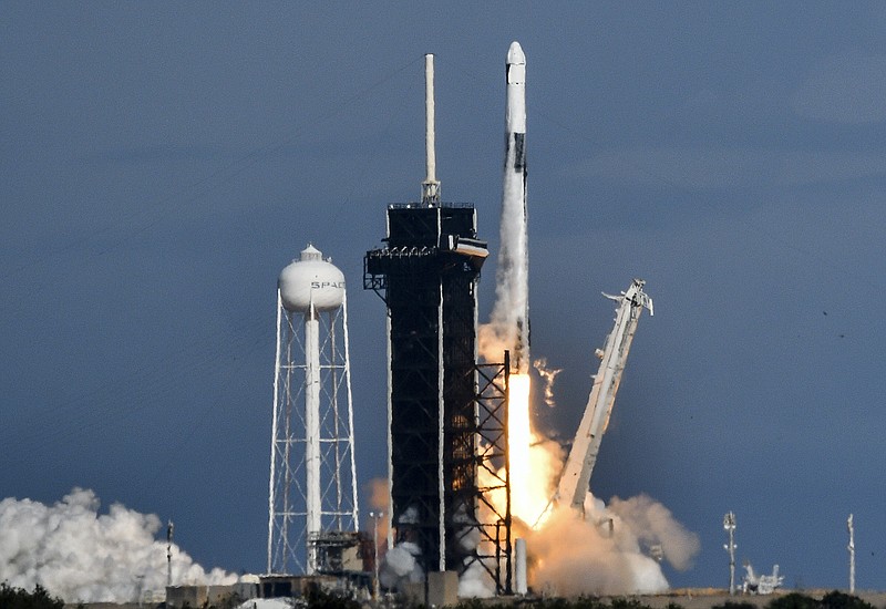A SpaceX Falcon 9 rocket lifts off Saturday from Pad 39A at Kennedy Space Center in Cape Canaveral, Fla., with cargo bound for the International Space Station. A brand new Dragon spacecraft is packed with 7,700 pounds of supplies, among them solar arrays to boost power on the station and a kit to grow dwarf tomatoes.
(AP/Florida Today/Craig Bailey)