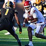 Arkansas quarterback KJ Jefferson (1) carries the ball as Missouri defensive back Jaylon Carlies (1) prepares to tackle, Friday, Nov. 25, 2022, during the second quarter at Faurot Field in Columbia, Mo. Visit nwaonline.com/221126Daily/ for the photo gallery.