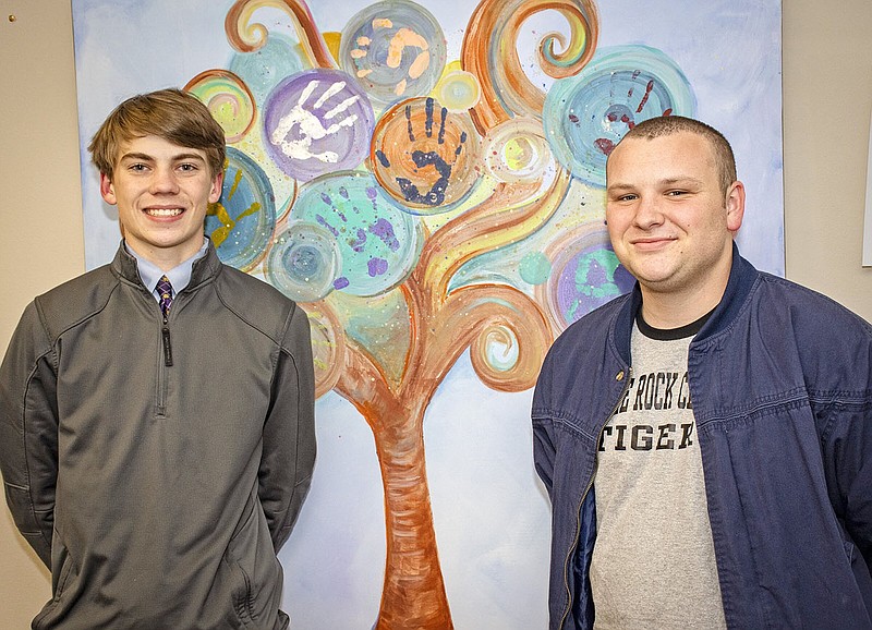 Ted Penick (left), a junior at Catholic High, and Phillip Byrd, a Central High junior on track to graduate early, are two of 58 Champions of Hope, volunteering time and raising money for The Centers for Youth and Family.
(Arkansas Democrat-Gazette/Cary Jenkins)