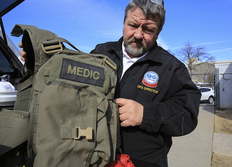 Greg Thompson, executive director of Metropolitan Emergency Medical Services (MEMS), displays a bullet-resistant medic vest at MEMS headquarters in Little Rock in this Jan. 26, 2016 file photo. First responders wear the vests when dispatched with SWAT teams. (Arkansas Democrat-Gazette/Staton Breidenthal)