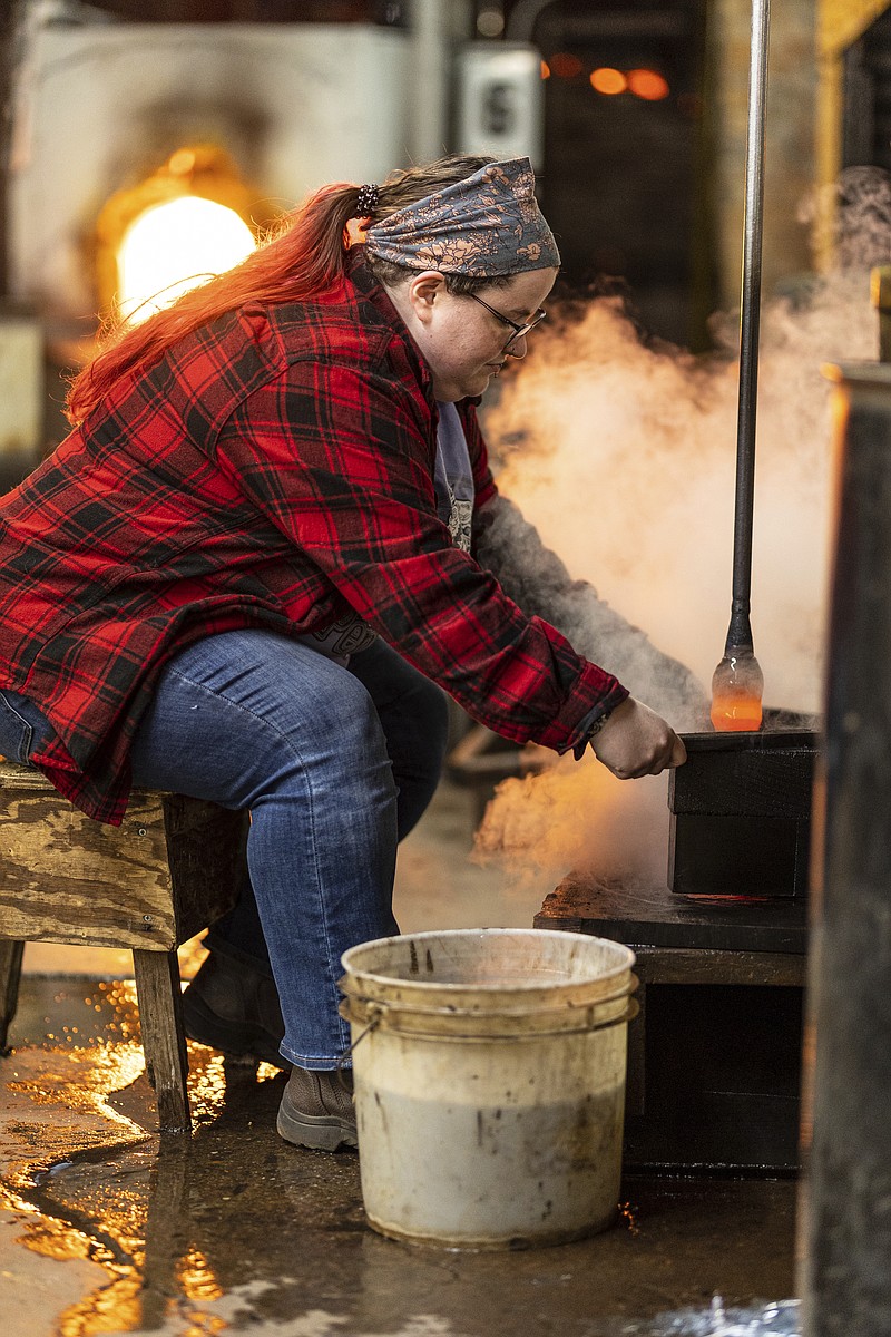 Apprentice Tabby Locascio works at Blenko Glass before an apprentice signing ceremony with the U.S. Department of Labor Office of Apprenticeship and the West Virginia Department of Economic Development on Wednesday, Nov. 16, 2022, at Blenko Glass in Milton, W.Va. (Sholten Singer/The Herald-Dispatch via AP)