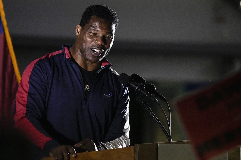 FILE - Republican nominee for U.S. Senate Herschel Walker speaks during a campaign rally on Thursday, Nov. 10, 2022, in Canton, Ga. Walker is in a runoff with incumbent Democrat Raphael Warnock. (AP Photo/John Bazemore, File)