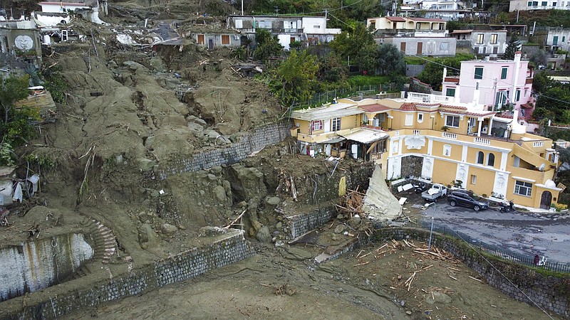 An aerial view of damaged houses after heavy rainfall triggered landslides that collapsed buildings and left as many as 12 people missing, in Casamicciola, on the southern Italian island of Ischia, Sunday, Nov. 27, 2022. (AP/Salvatore Laporta)