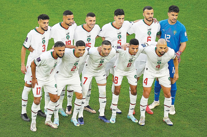 Morocco players pose before the start of Sunday's World Cup Group F match against Belgium in Doha, Qatar. (Associated Press)