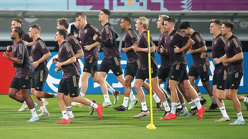German players warm up during a training session Friday in Al-Ruwais, Qatar. (Associated Press)