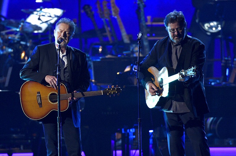 Don Henley (left) and Vince Gill perform "Eagle When She Flies" in Los Angeles in this Feb. 8, 2019 file photo. Henley is a founding member of The Eagles dating back about 50 years, while Gill joined the band in 2017 after the death of Eagles co-founder Glenn Frey. (Chris Pizzello/Invision/AP)