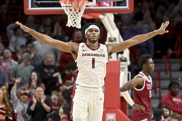 Arkansas guard Ricky Council IV (1) celebrates after scoring against Troy during the first half of an NCAA college basketball game, Monday, Nov. 28, 2022, in Fayetteville. (AP Photo/Michael Woods)
