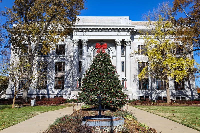 Staff photo by Olivia Ross  / A Christmas tree stands in front of the Hamilton County Courthouse on Tuesday, November 29, 2022. A tree lighting ceremony will be held Friday, December 2, on the courthouse lawn.