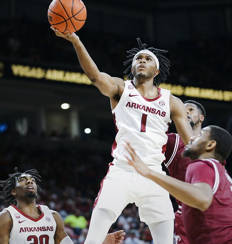 Arkansas guard Ricky Council IV (1) shoots, Monday, November 28, 2022 during the second half of a basketball game at Bud Walton Arena in Fayetteville. Visit nwaonline.com/221129Daily/ for today's photo gallery...(NWA Democrat-Gazette/Charlie Kaijo)