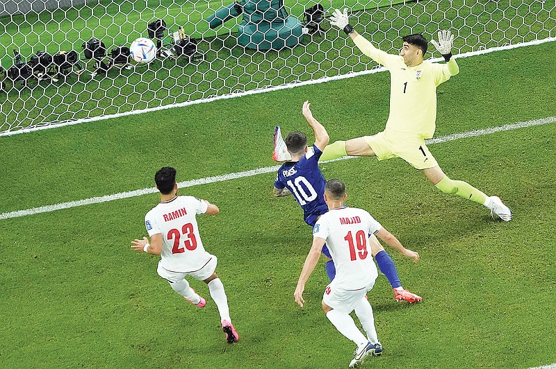 Christian Pulisic of the U.S. scores a goal Tuesday during the World Cup Group B match against Iran in Doha, Qatar. (Associated Press)