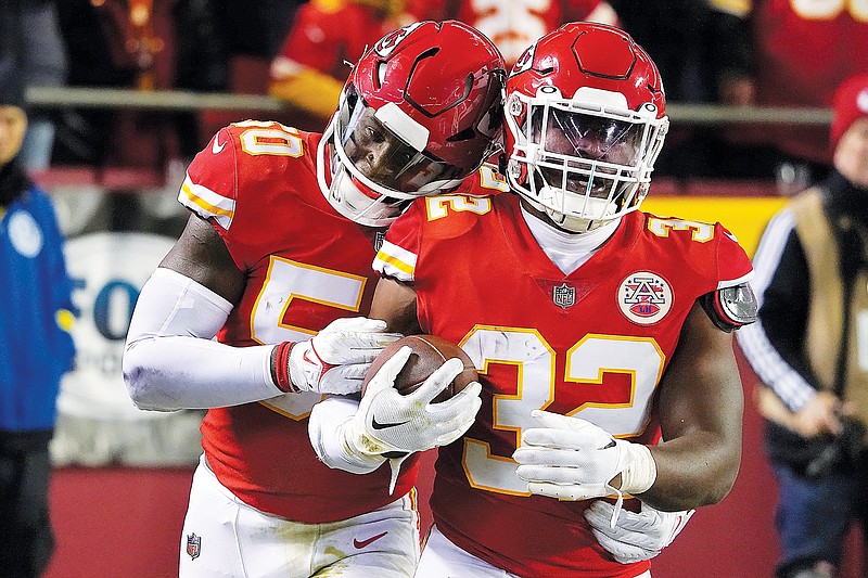 Chiefs linebacker Nick Bolton (32) celebrates his interception with linebacker Willie Gay during Sunday’s game against the Rams at Arrowhead Stadium in Kansas City. (Associated Press)