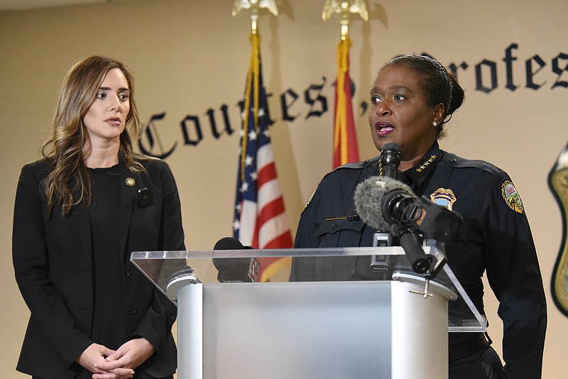 Staff Photo by Matt Hamilton / District attorney Coty Wamp looks on as police chief Celeste Murphy speaks during a press conference on Wednesday, November 30, 2022.