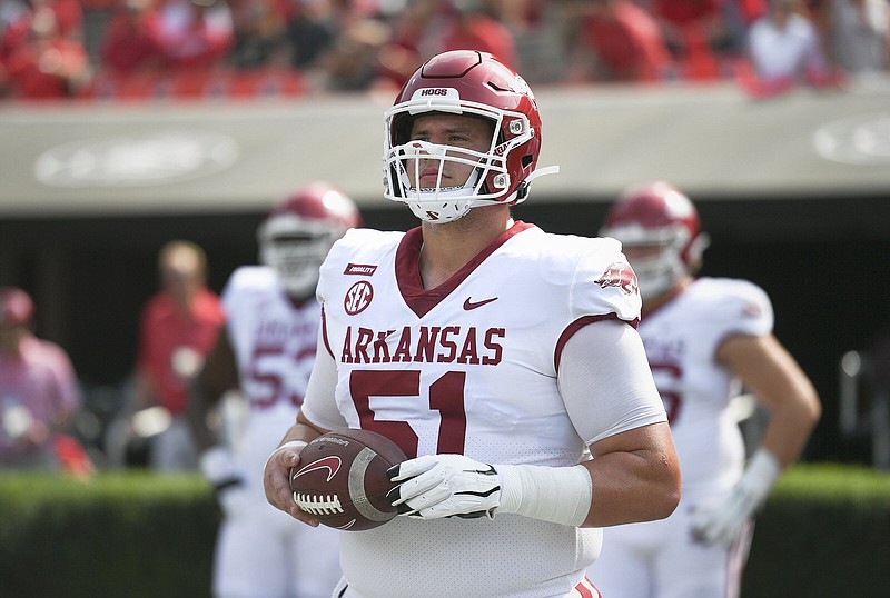 Arkansas offensive lineman Ricky Stromberg (51) looks on, Saturday, October 2, 2021 during a football game at Sanford Stadium in Athens, Ga. Check out nwaonline.com/211003Daily/ for today's photo gallery. .(NWA Democrat-Gazette/Charlie Kaijo)