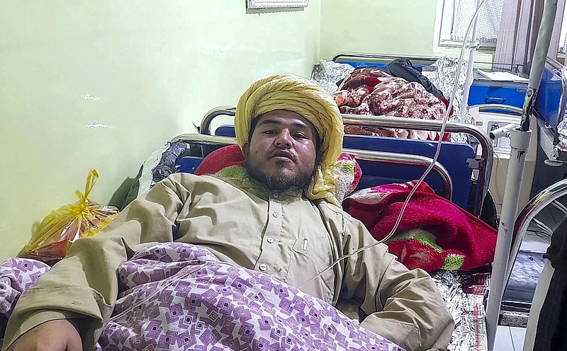 A wounded man receives treatment at a hospital after a deadly bomb blast Wednesday at a religious school in Aybak, the capital of the Samangan province in northern Afghanistan.
(AP/Saifullah Karimi)