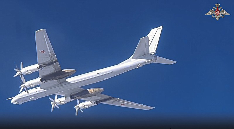 In this photo released on Wednesday, a view of a Tu-95 strategic bomber of the Russian air force taking off for a joint air patrol with Chinese bombers at an airbase in an unspecified location in Russia.
(AP/Russian Defense Ministry Press Service)