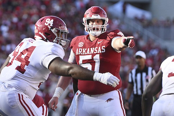 Arkansas offensive lineman Ricky Stromberg (51) gets ready to run a play against Alabama during an NCAA college football game Saturday, Oct. 1, 2022, in Fayetteville. (AP Photo/Michael Woods)