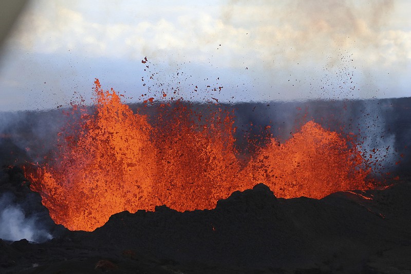 This aerial image courtesy of Hawaii Dept. of Land and Natural Resources shows lava flows on Mauna Loa, the world's largest active volcano, on Wednesday, Nov. 30, 2022, near Hilo, Hawaii. (Hawaii Dept. of Land and Natural Resources via AP)
