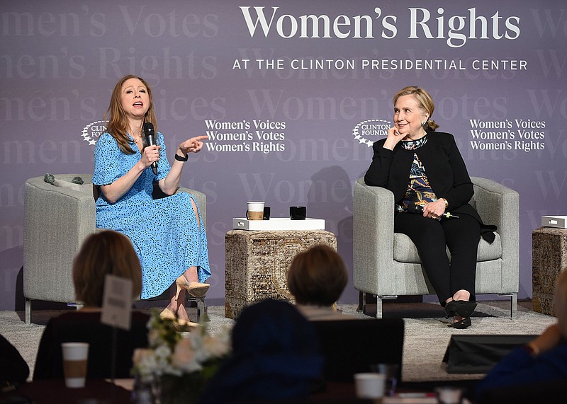 Clinton Foundation Vice Chair Chelsea Clinton (left) speaks as her mother, former Secretary of State Hillary Rodham Clinton, listens during the Women’s Voices Summit on Friday at the Clinton Presidential Center in Little Rock.
(Arkansas Democrat-Gazette/Staci Vandagriff)