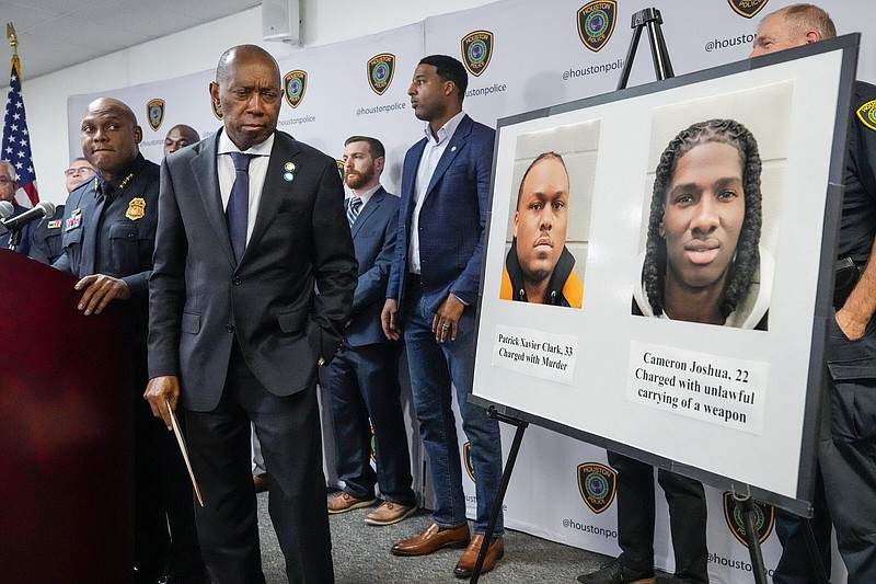 Houston Police Chief Troy Finner (left) and Mayor Sylvester Turner announce an arrest in connection with the fatal shooting of Kirsnick Khari Ball, commonly known as Migos rapper Takeoff, during a news conference on Friday in Houston.
(AP/Houston Chronicle/Brett Coomer)