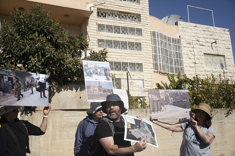 An Israeli activist gives a tour of the embattled West Bank city of Hebron on Friday.
(AP/Maya Alleruzzo)