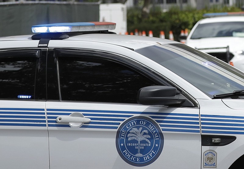 Police cars from the city of Miami are shown in this March 25, 2020 file photo. (AP/Wilfredo Lee)