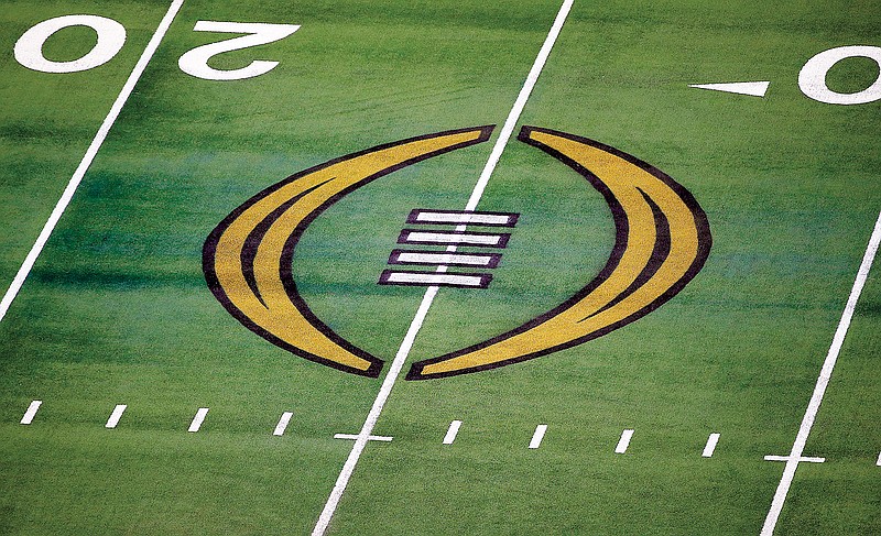 In this Jan. 1, 2021, file photo, the College Football Playoff logo is shown on the field in Arlington, Texas. (Associated Press)