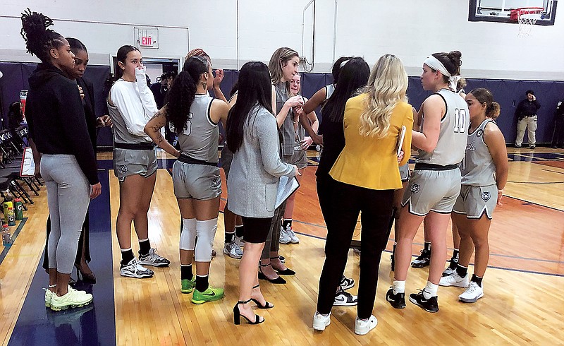 The Lincoln women huddle during Thursday night's game against Newman at Jason Gym. (Trevor Hahn/News Tribune)