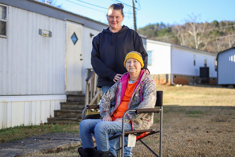 Staff photo by Olivia Ross  / Penny Moore, left, stands with her mother, Patricia Kirkland, outside their home on Wednesday. Moore was a recipient of the Neediest Cases Fund.