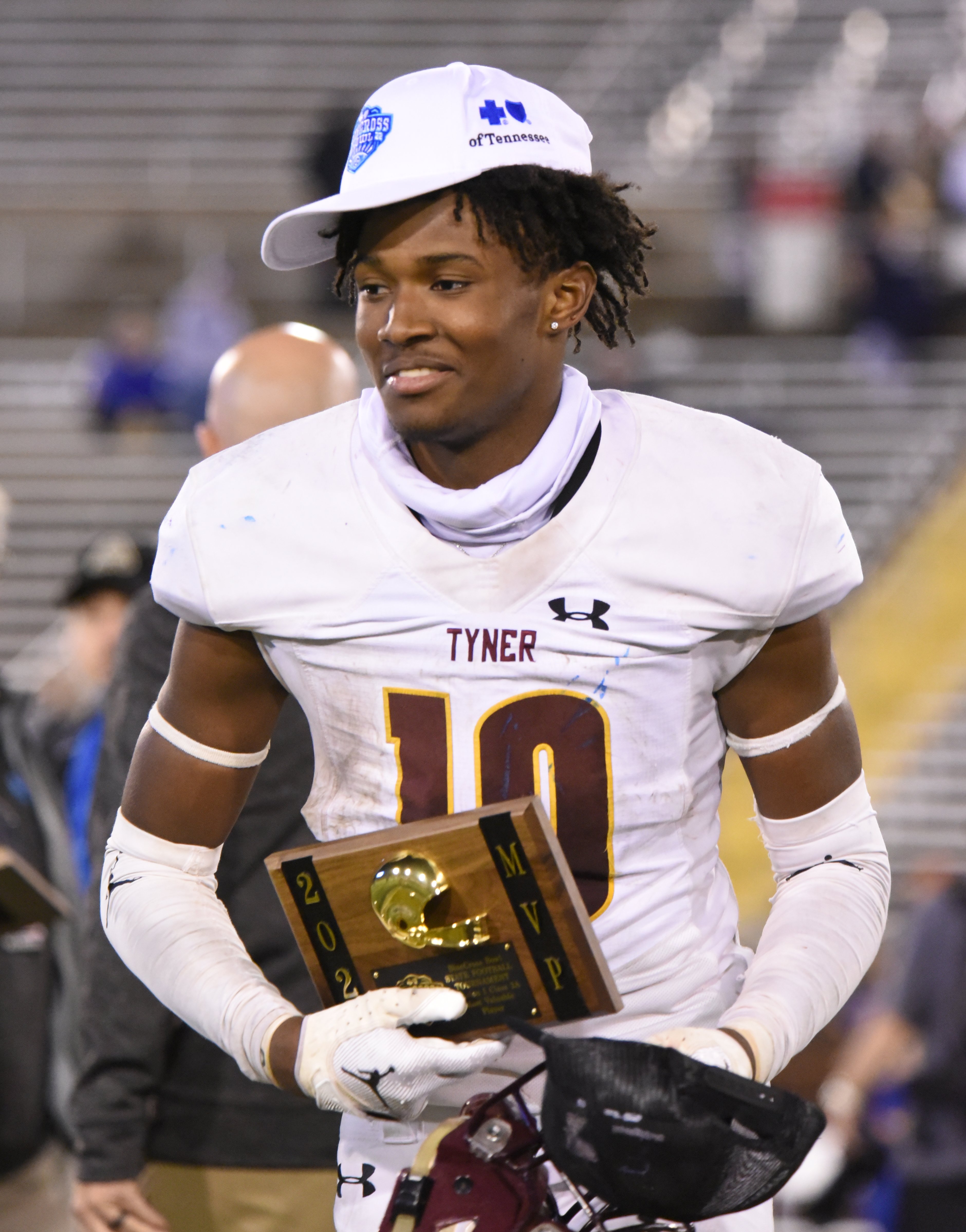 Staff Photo by Matt Hamilton / Tyner (10) McKinley Markel accepts his MVP plaque after the Class 2A BlueCross Bowl state championship game at Finley Stadium on Saturday, December 3, 2022.